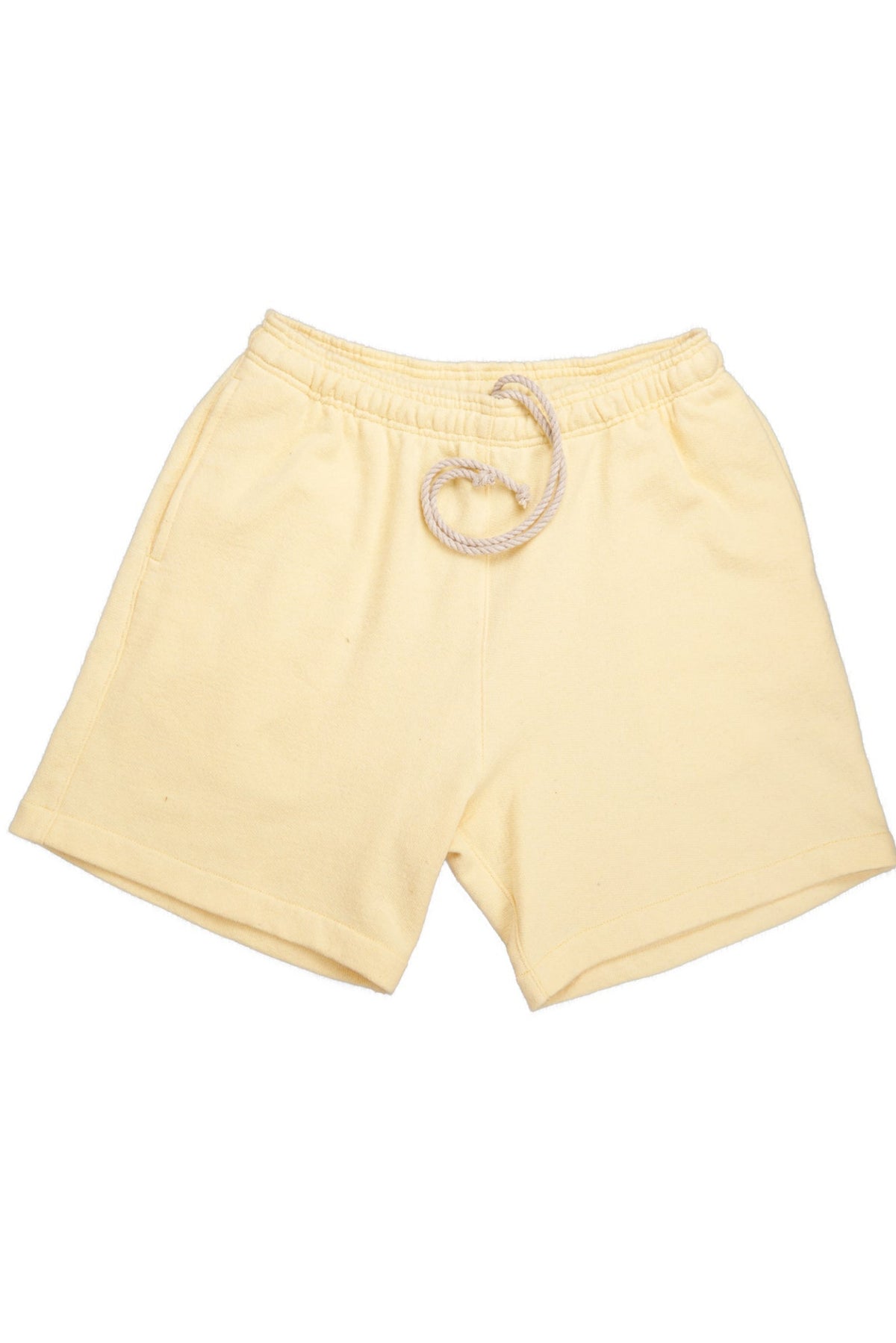 A pair of yellow shorts made from upcycled cotton terry fabric, featuring a drawstring waist.